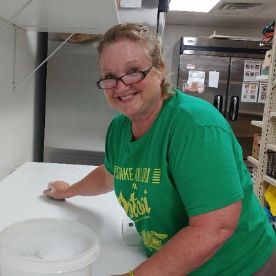 Jean cleaning food pantry.